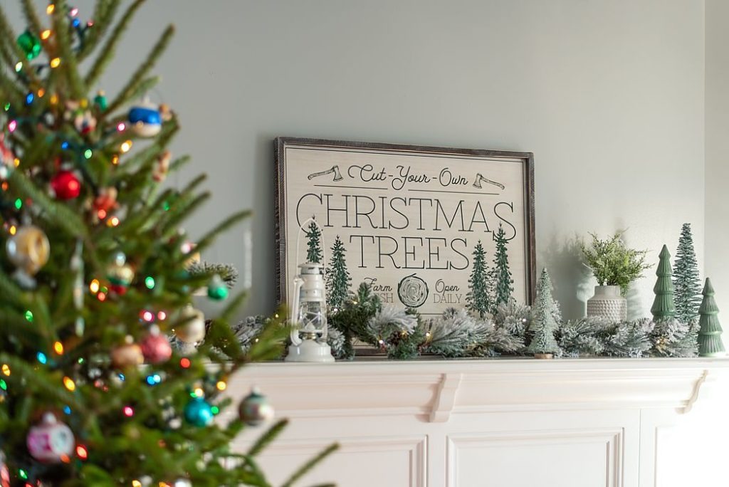 Flocked garland and miniature Christmas tree dress up this Florida mantel.