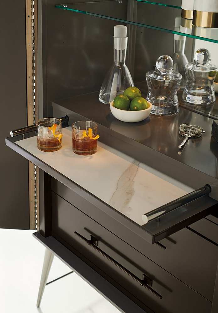 Luxury furniture and case goods from Caracole show off the beautiful finishes to cabinetry.