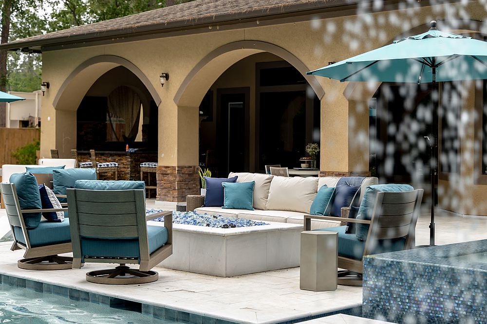 Outdoor patio furniture arranged for comfortable conversation and entertaining.