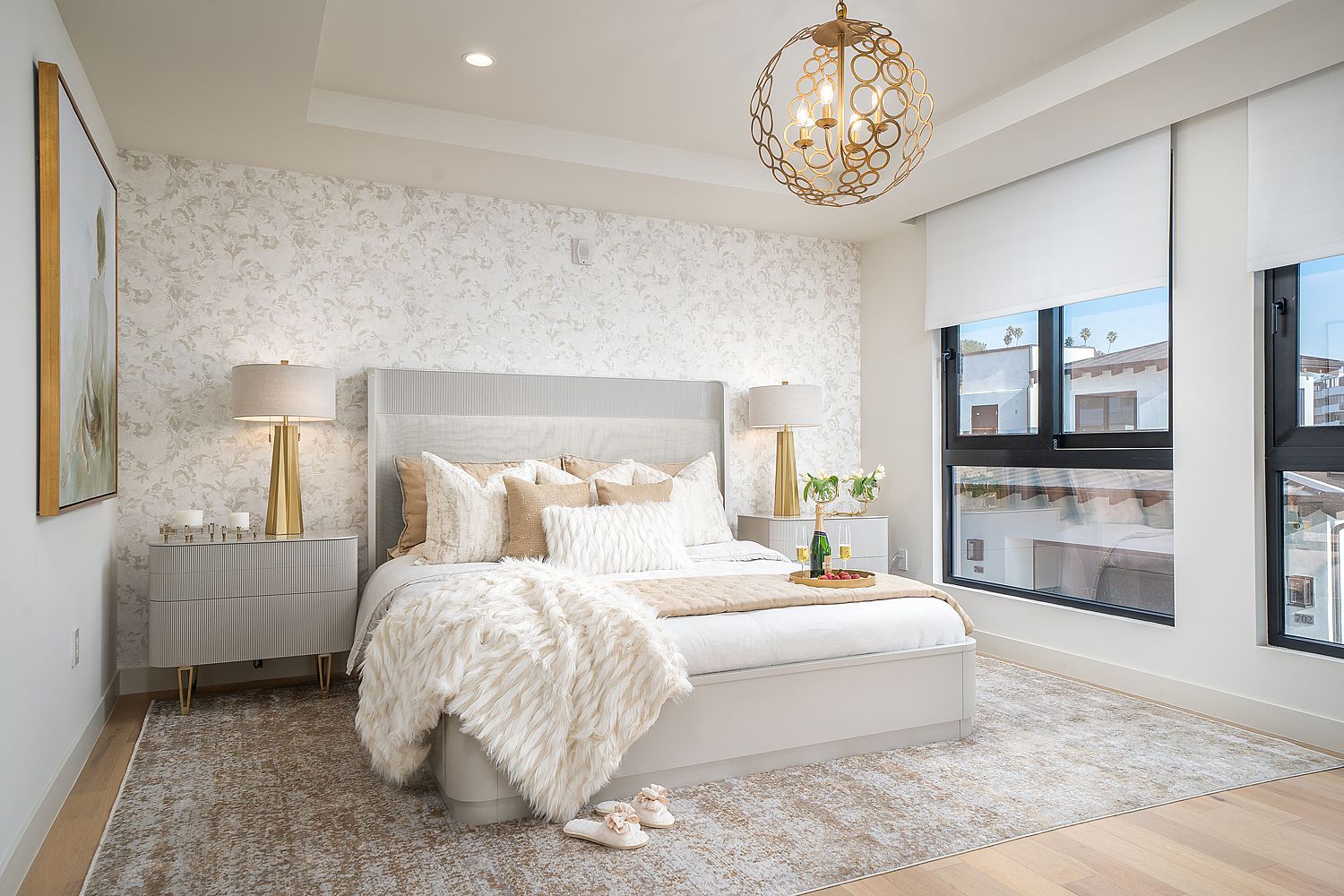 Bedroom with layered lighting including bedside lamps and decorative ceiling light.
